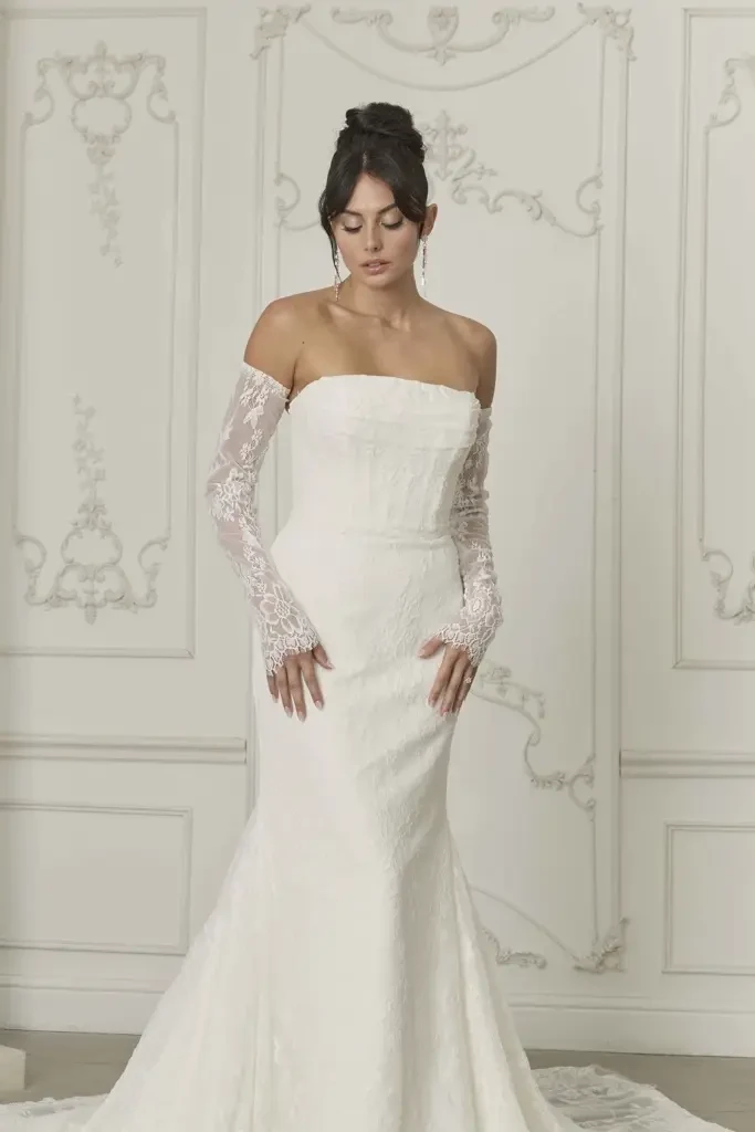 model is wearing a strapless fit and flare wedding dress